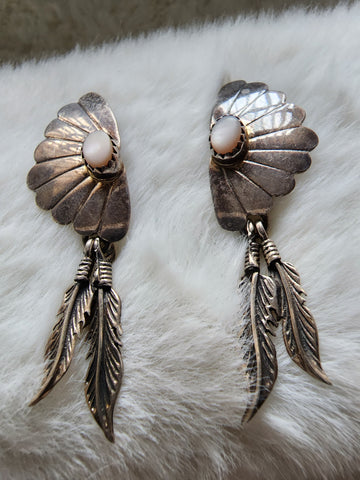 Navajo Sterling Silver Feather w/ Mother of Pearl 1.75in Earrings     (Vintage)   Artist: unsigned  Excellent vintage condition with moderate patina. Earrings need a good session with a polishing cloth. Stones are in perfect condition.