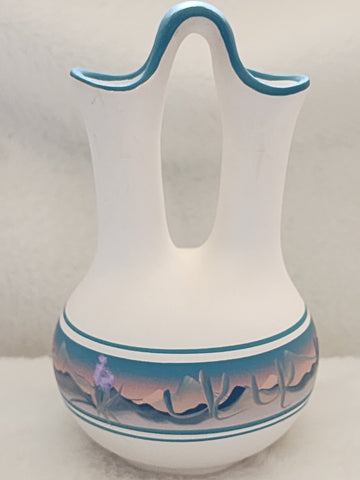 Navajo Wedding Vase     (Vintage)  Artist:  Vase is signed, but I am not able to verify who signature belongs to.  Beautiful vase, a few blemishes as seen in pictures.  I've had this in my personal collection for over 5 years, so I am unsure of what the 23 stands for.